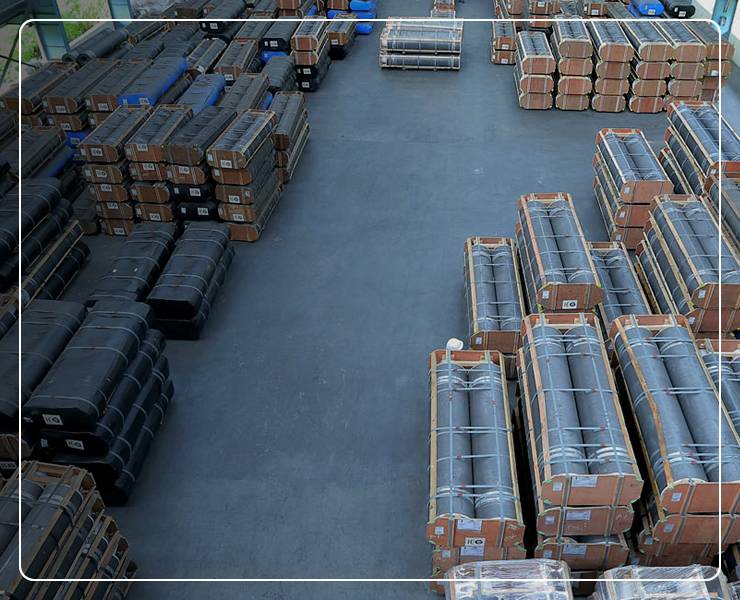 Packed graphite electrodes are stored in dry warehouses.